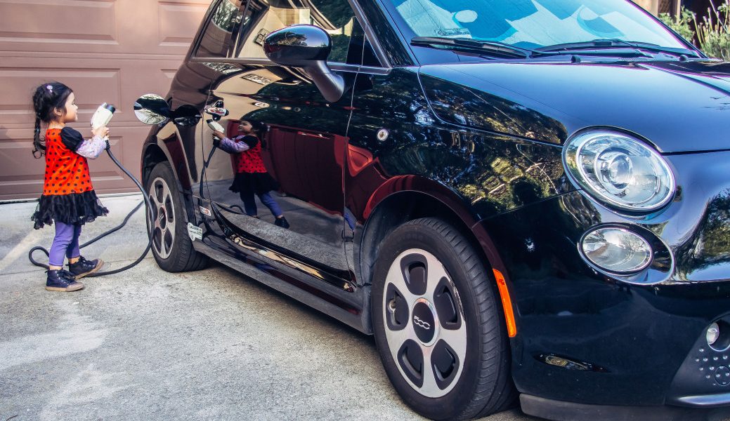 little-ladybug-girl-charging-ev-electric-car-for-her-parents-even-luigi-the-fiat-500e-needs-electric_t20_XQGXvb